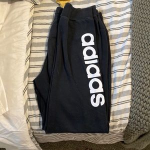 Adidas Cotton Joggers size L. Adidas is written in white along the left leg.